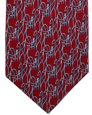 Red Ferragamo tie with blue animal pattern on a white background